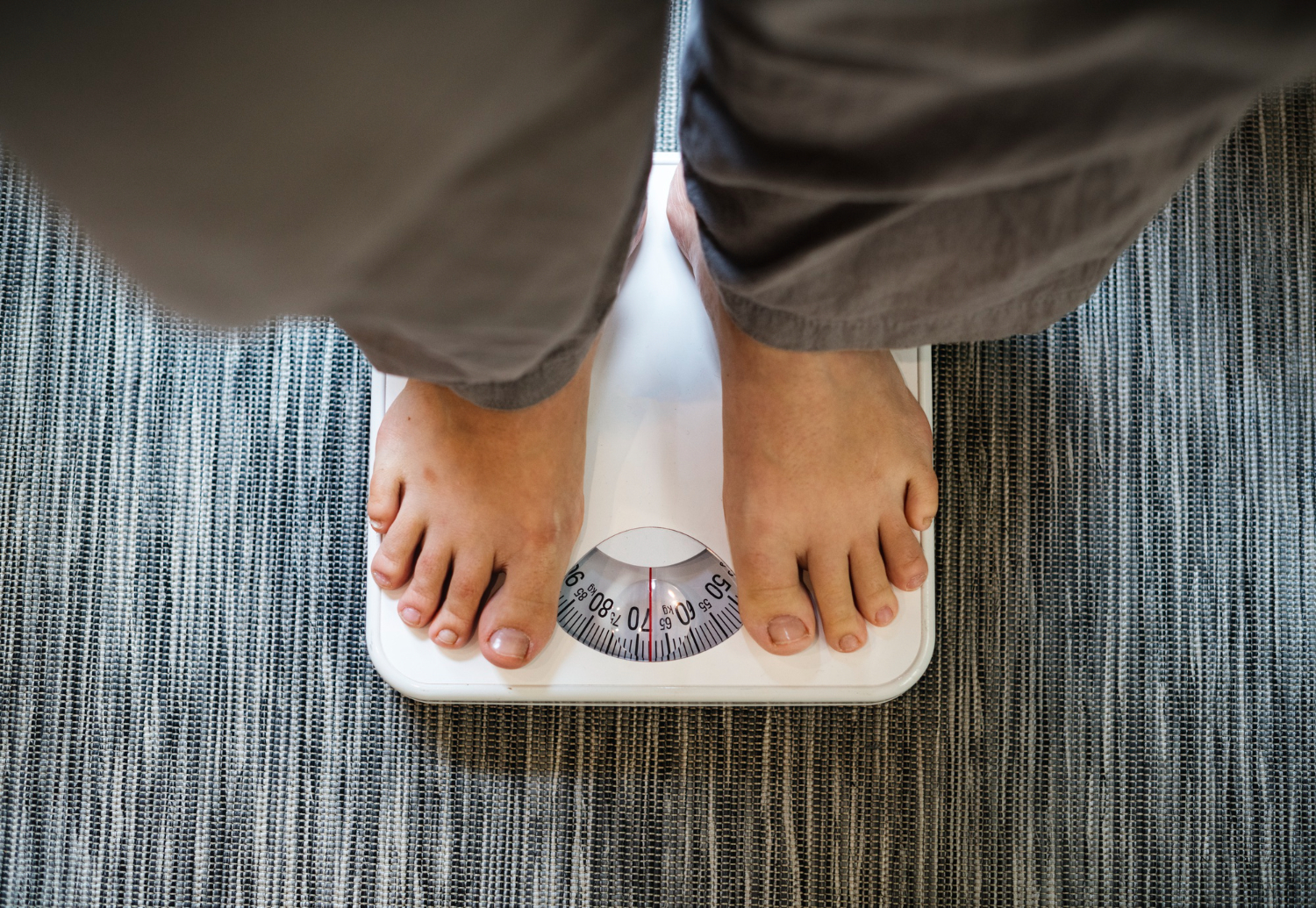 A person on a weighing scale