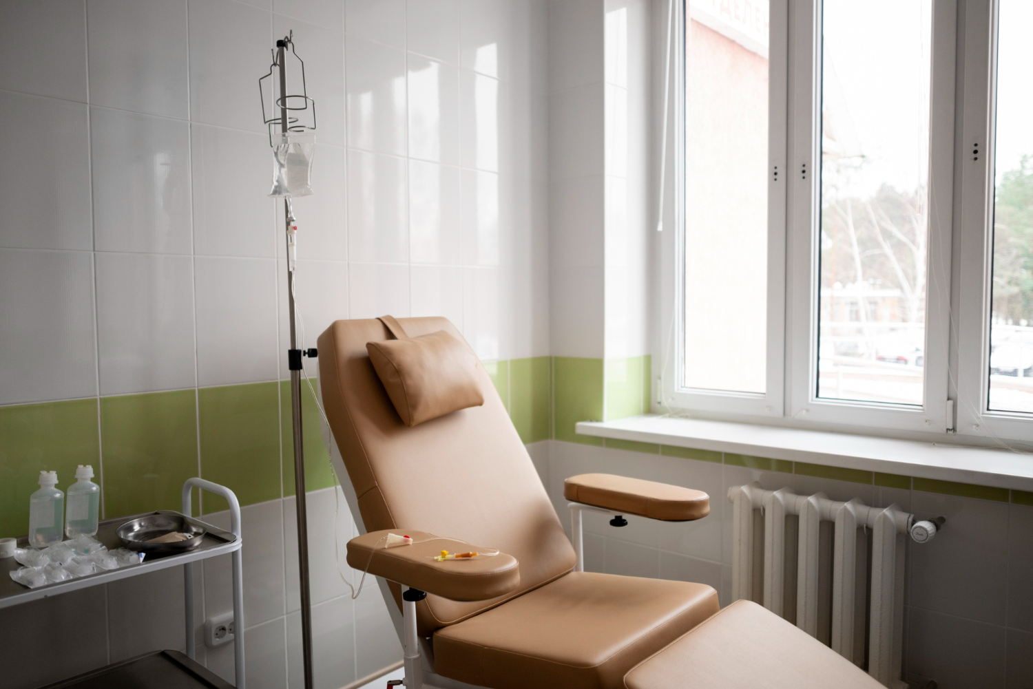 A wellness center with a reclining chair and IV drips at its side
