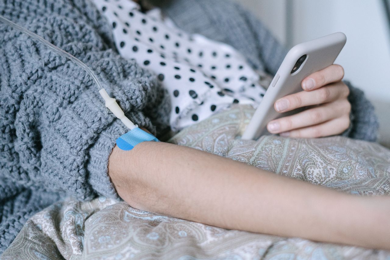 A woman receiving intravenous therapy