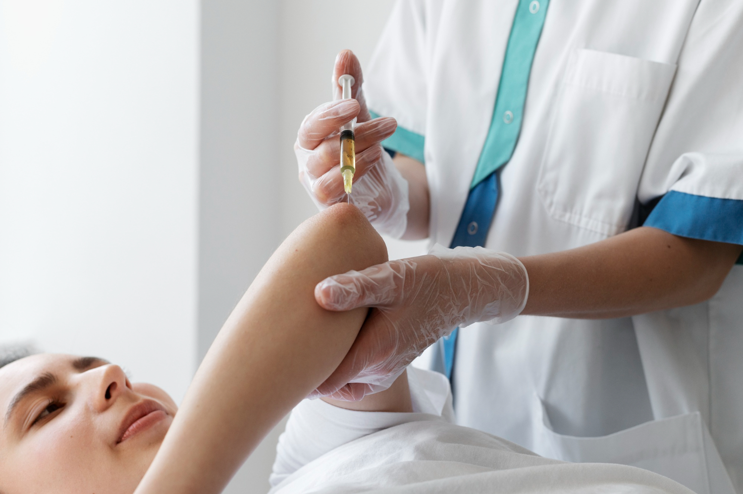 A woman having a stem cell therapy injection in her elbows